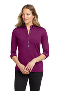 OGIO Women's Gauge Polo. LOG122 - Berry Burst - front